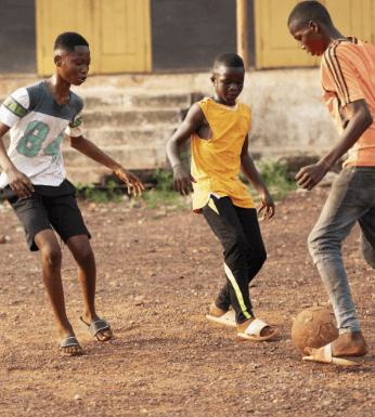 a group of childs playing football